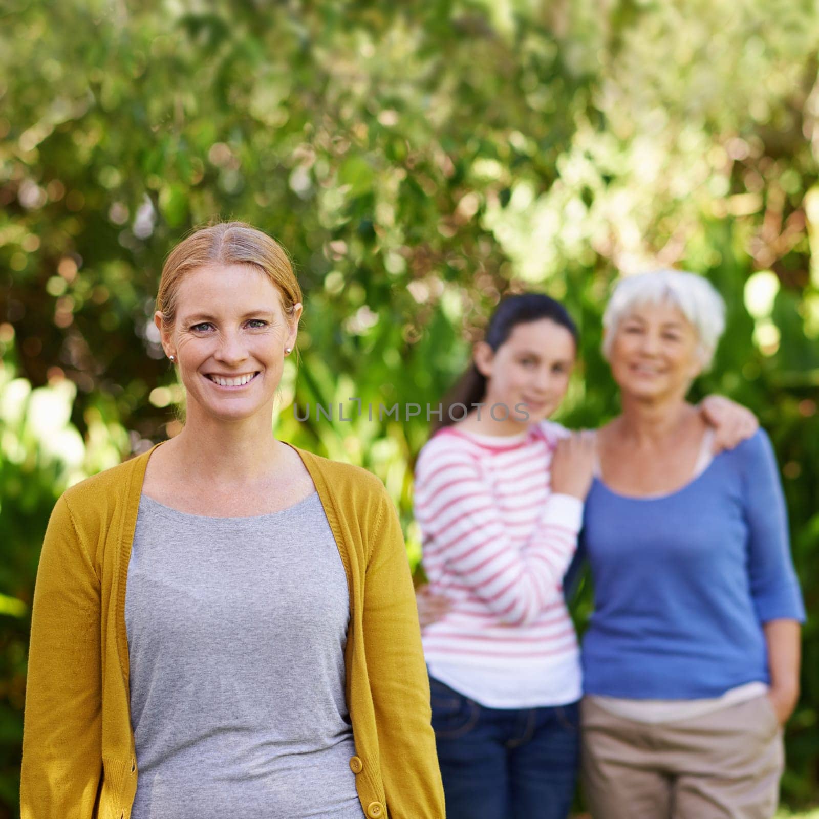Nature, portrait and woman with kid and grandmother in outdoor park, field or garden together. Happy, smile and female person with girl child and senior mother in retirement in backyard in Canada