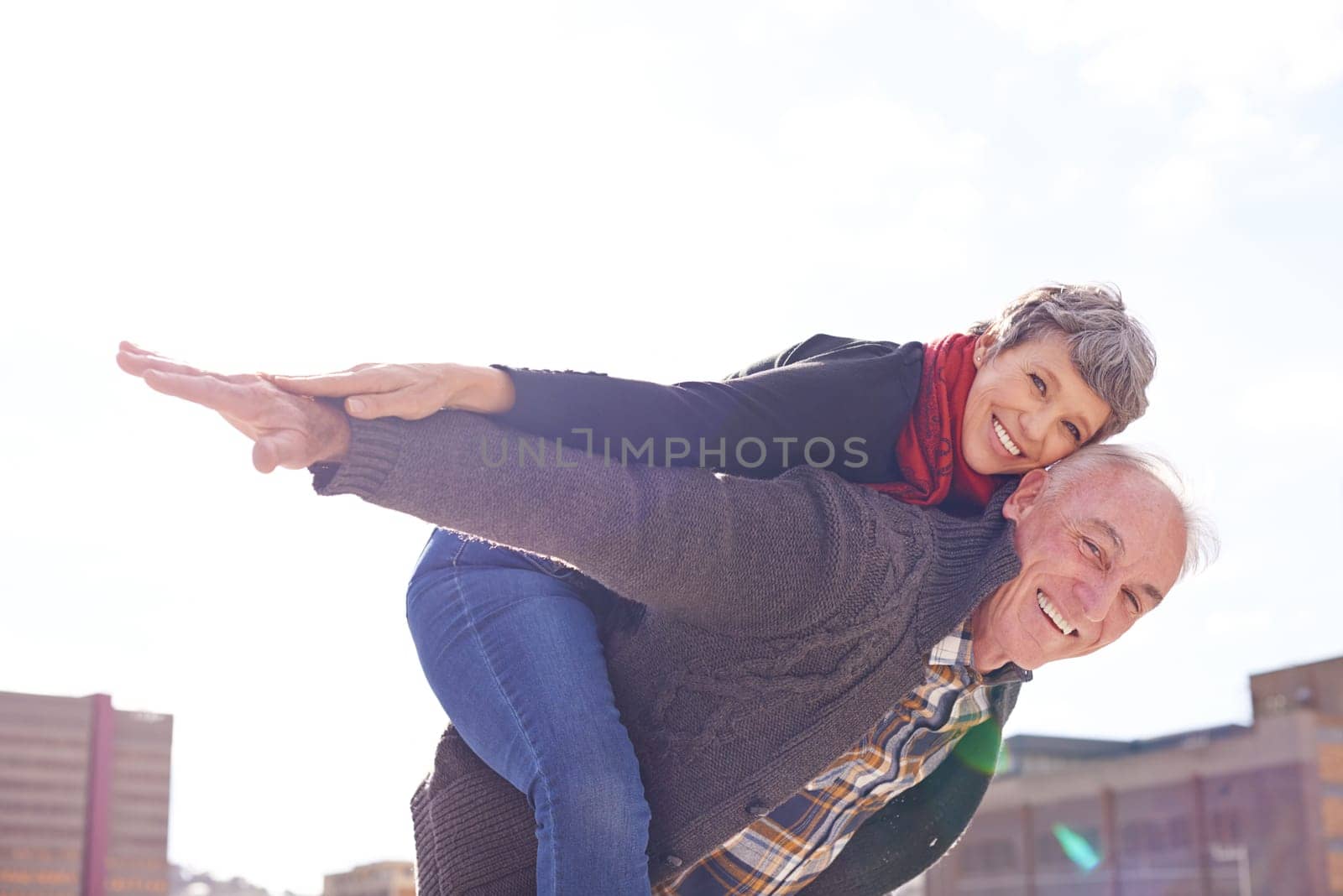 Portrait, mature couple and piggyback or romantic on vacation, retirement holiday and celebrate with smile. Happy, elderly people and marriage or love for bonding, care and romance in relationship by YuriArcurs