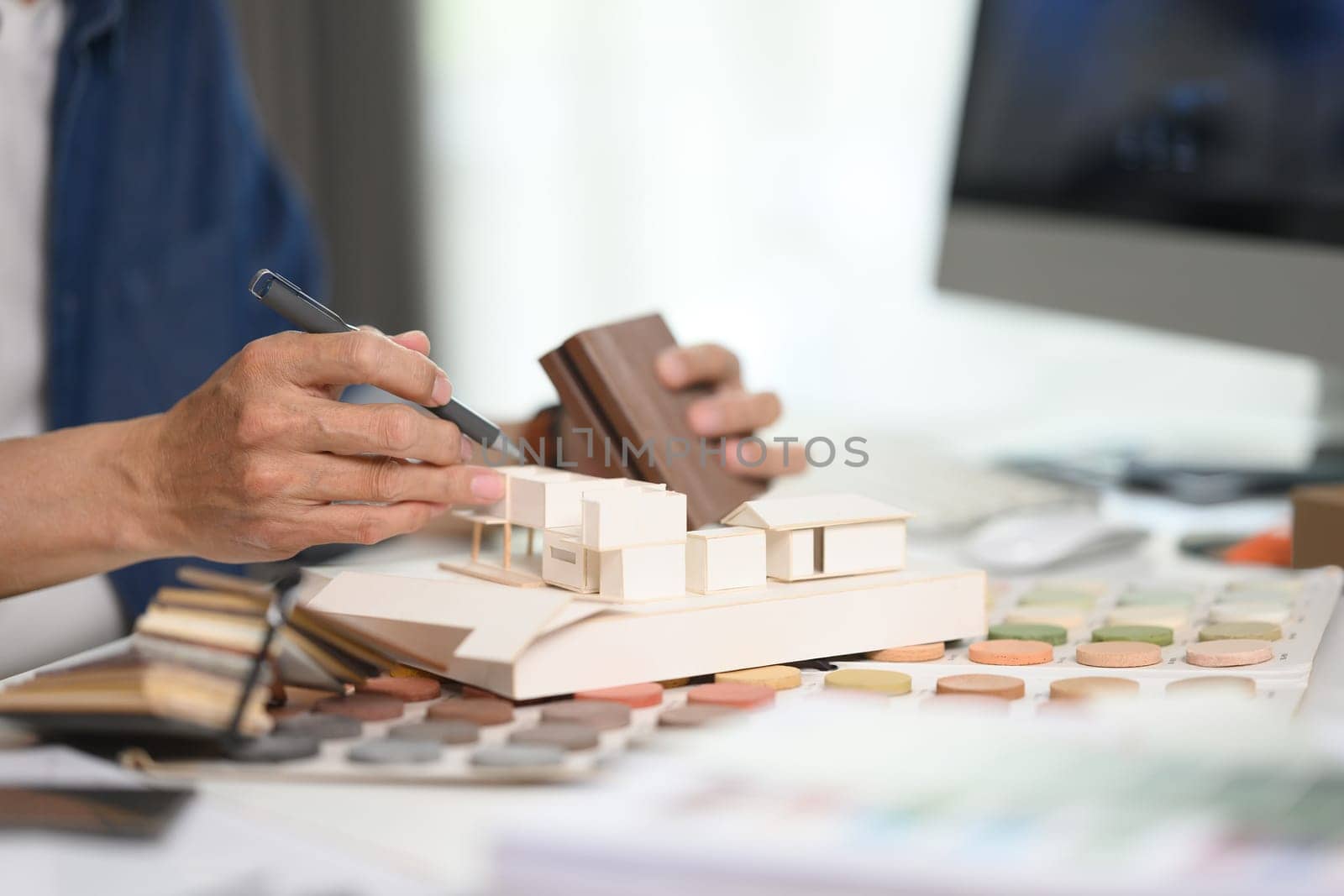 Cropped shot of interior designer working on home renovation project at office.