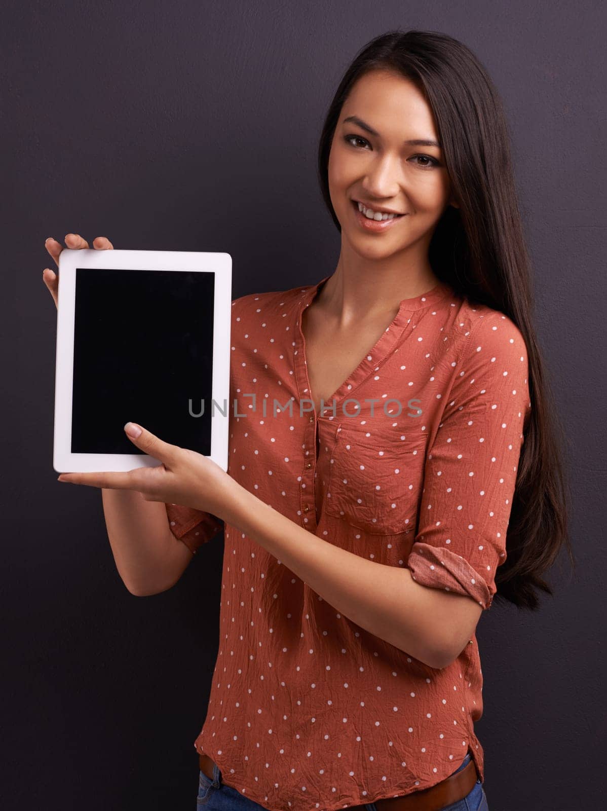 Woman, studio and tablet with mockup, screen and technology for communication and connectivity. Model, tech and confidence with smile, happiness and space for online app or social media connection.