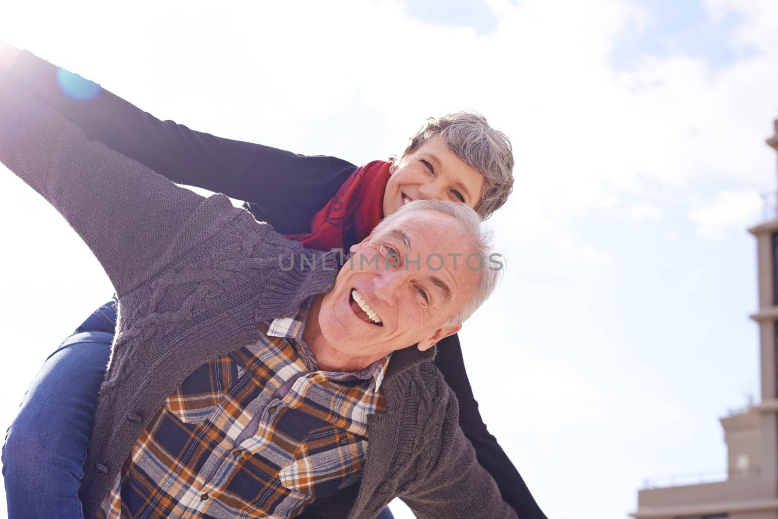 Portrait, happy couple and piggyback or love in vacation, retirement holiday and celebrate with smile. Outdoor, elderly people and marriage or commitment for bonding, care and romance in relationship.