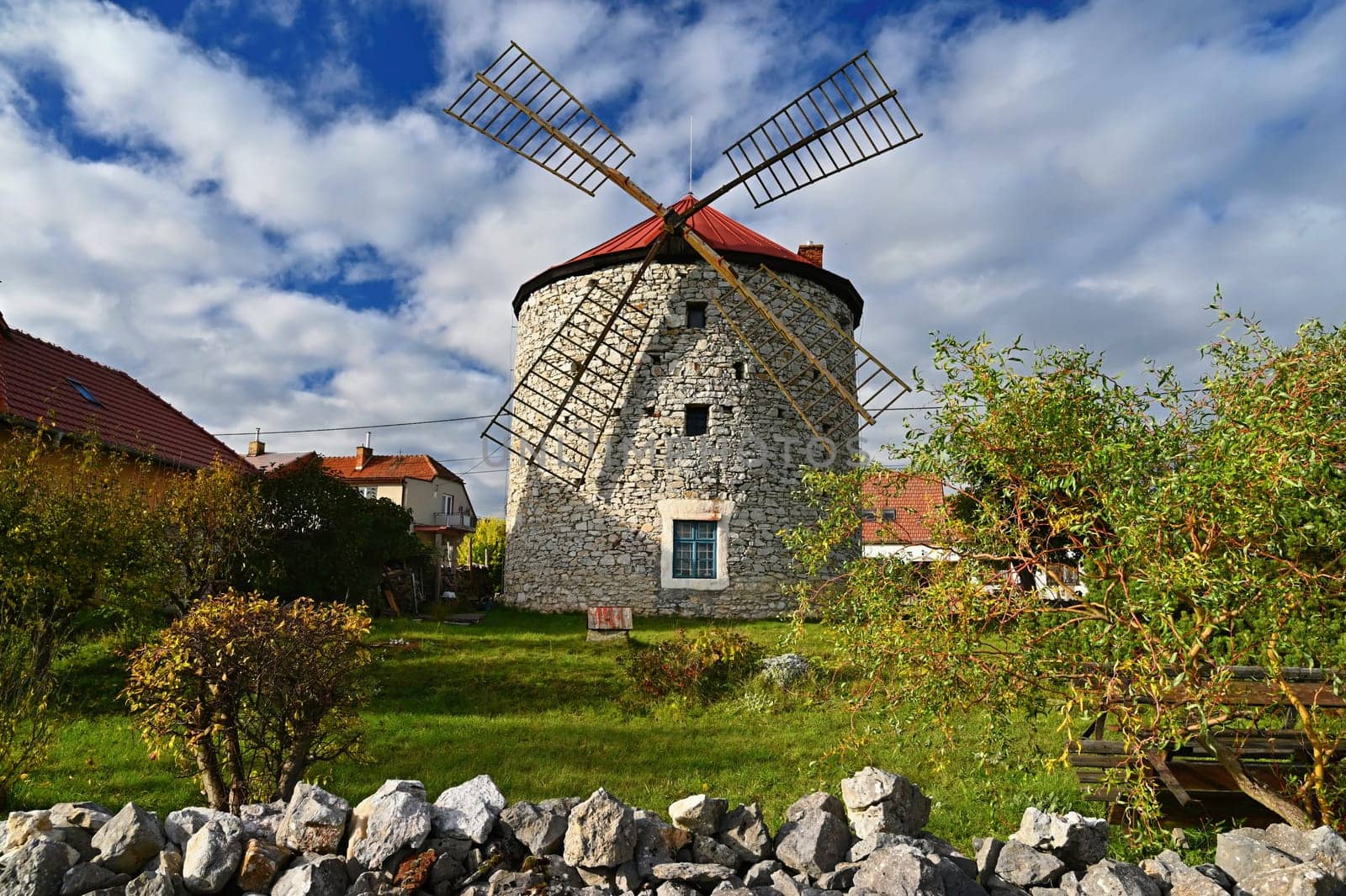 Beautiful old windmill and landscape with the sun. Ostrov u Macochy, Czech Republic. Europe. by Montypeter