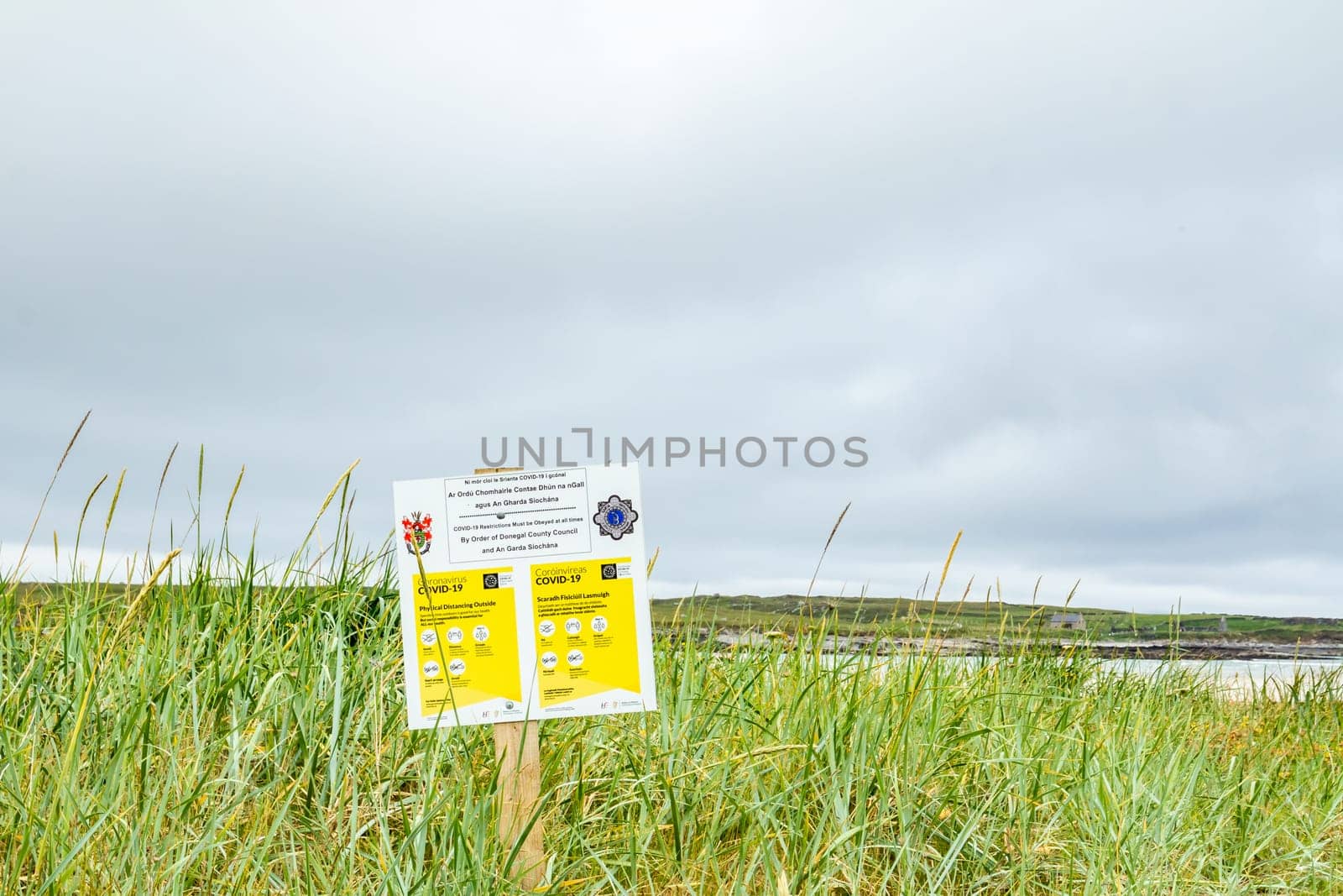 PORTNOO, COUNTY DONEGAL / IRELAND - JUNE 17 2020: Sign explaining the 2m social distancing rule at the beach.