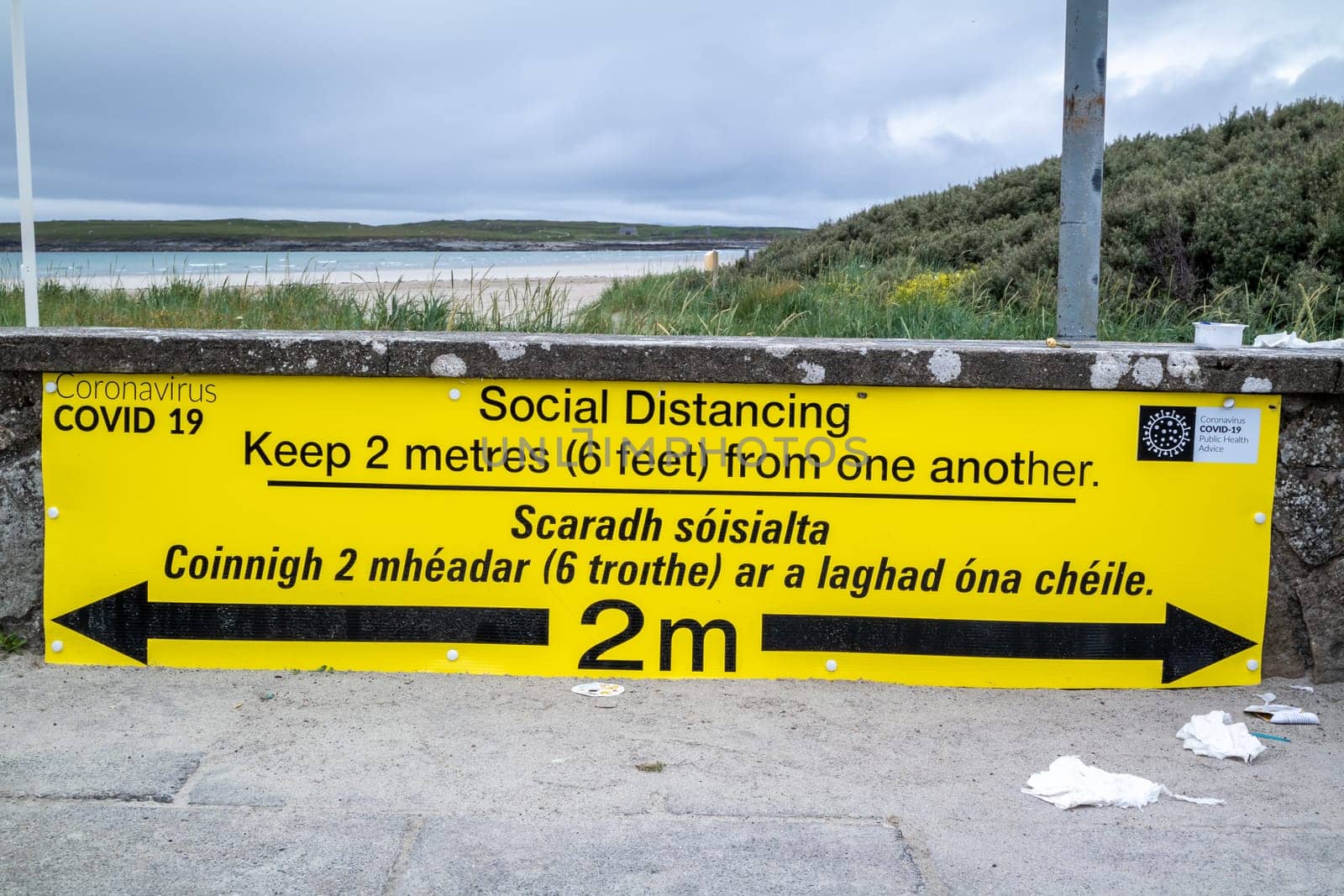 PORTNOO, COUNTY DONEGAL / IRELAND - JUNE 17 2020: Sign explaining the 2m social distancing rule at the beach.