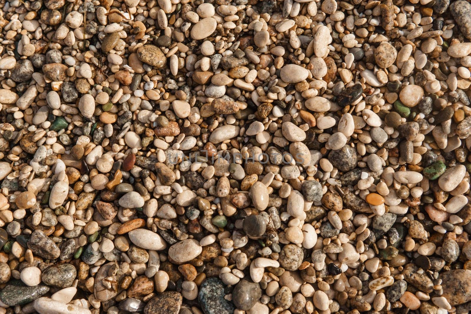 Pebbles on the seashore, close-up. Natural background. by Annu1tochka