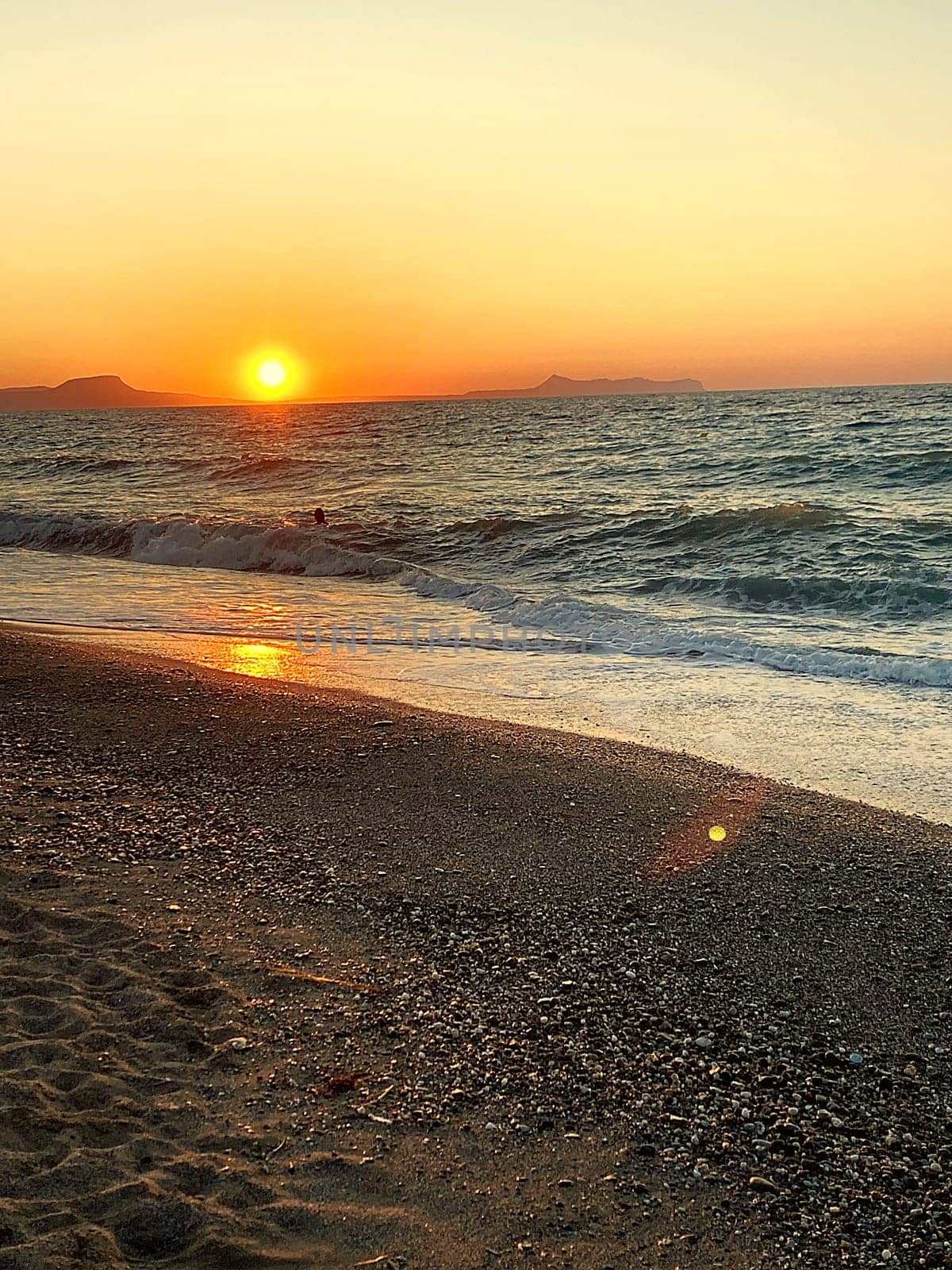 summer sunset on the sea coast in Creta, Greece, at 02 August 2023. Beautiful sunset by the sea in a beach on Kreta. Fantastic sunset on the Mediterranean Crete. High quality photo
