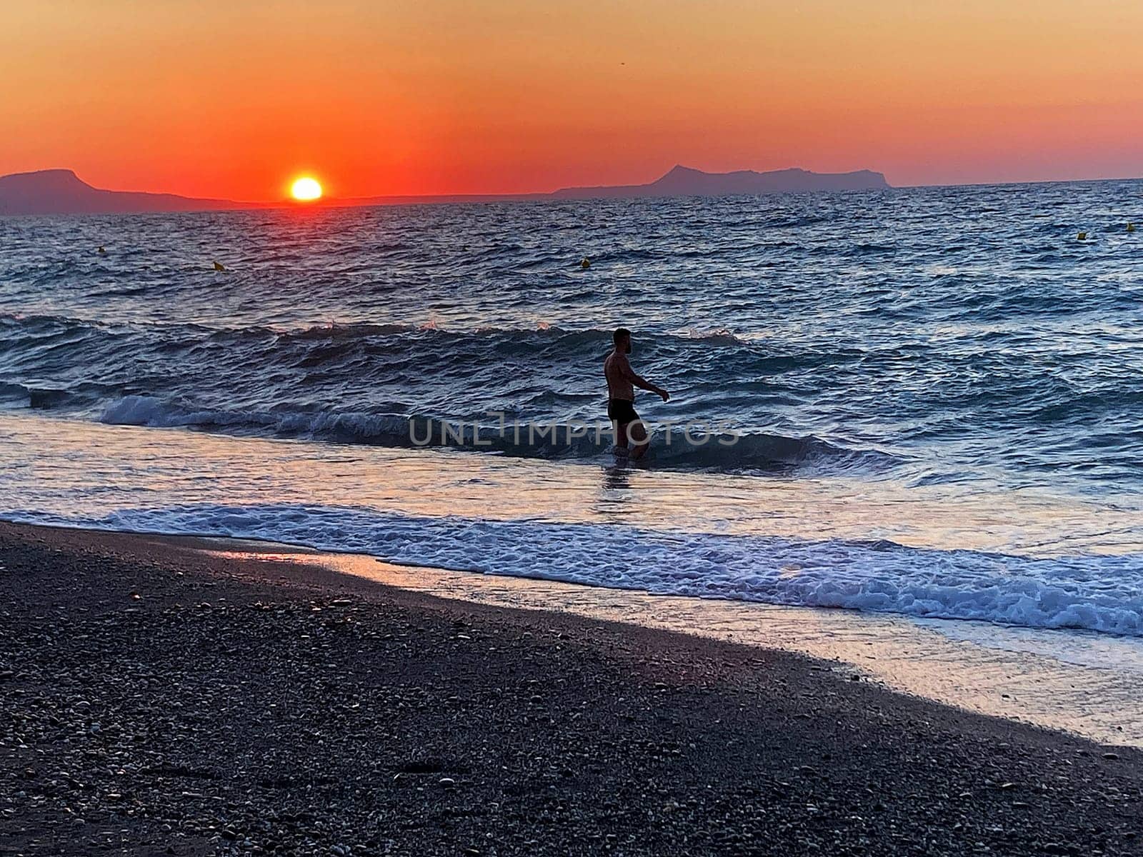summer sunset on the sea coast in Creta, Greece, at 02 August 2023. Beautiful sunset by the sea in a beach on Kreta. Fantastic sunset on the Mediterranean Crete by Costin
