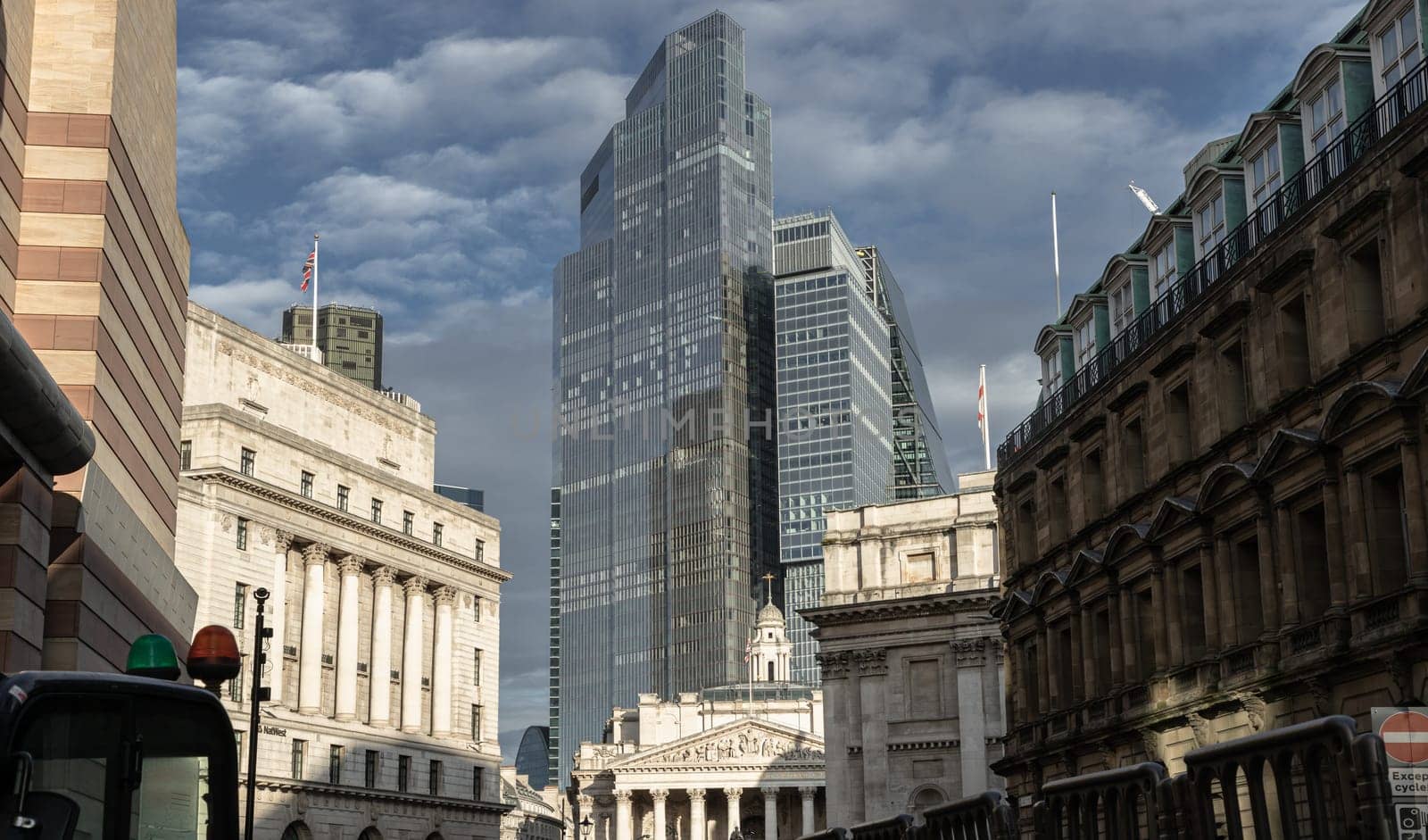London, UK - Feb 27, 2024 - View of Bank of England, Royal Exchange with skyscrapers in background of the City of London. Space for text, Selective focus.