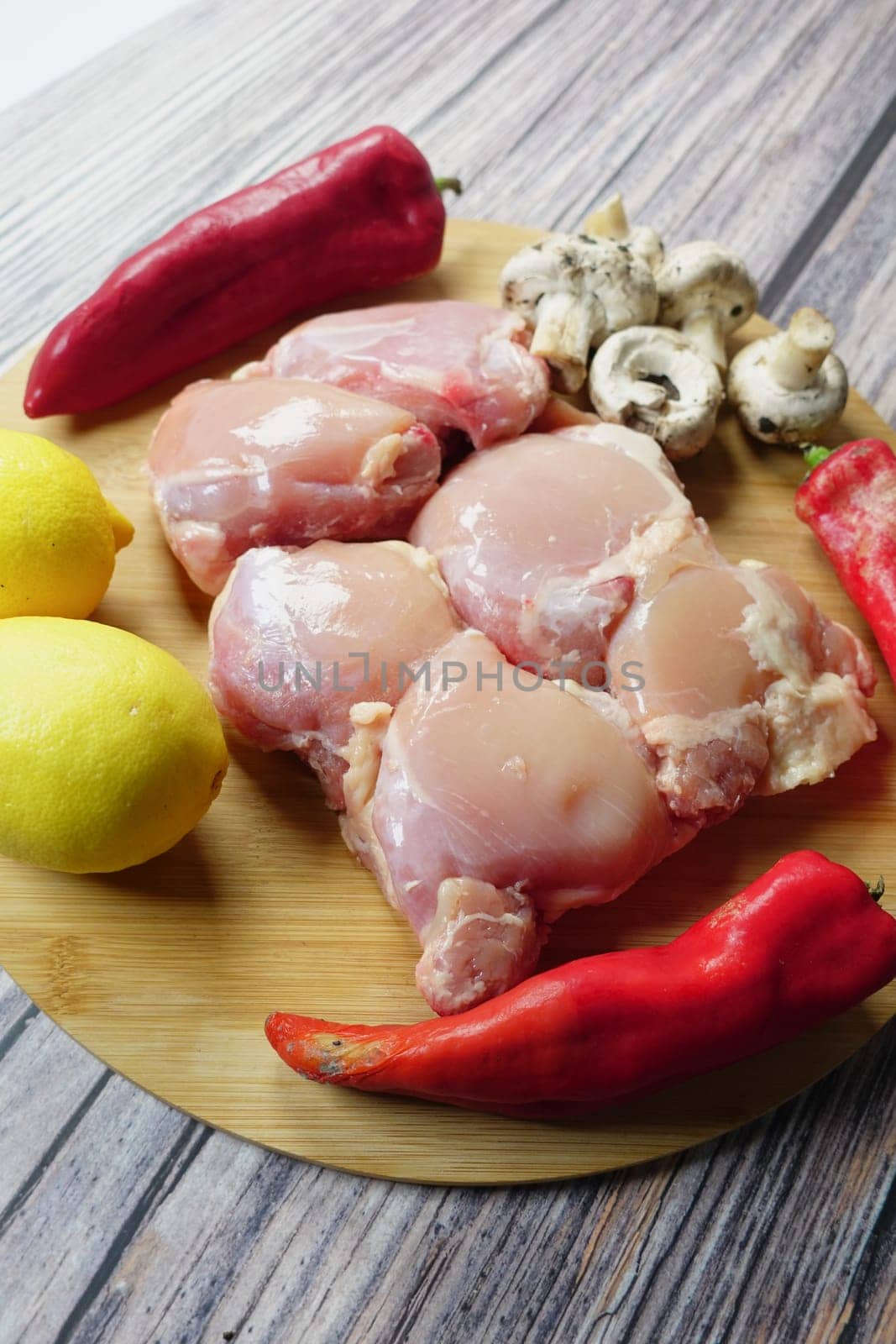top view of raw breast chicken meat and vegetables on table by towfiq007