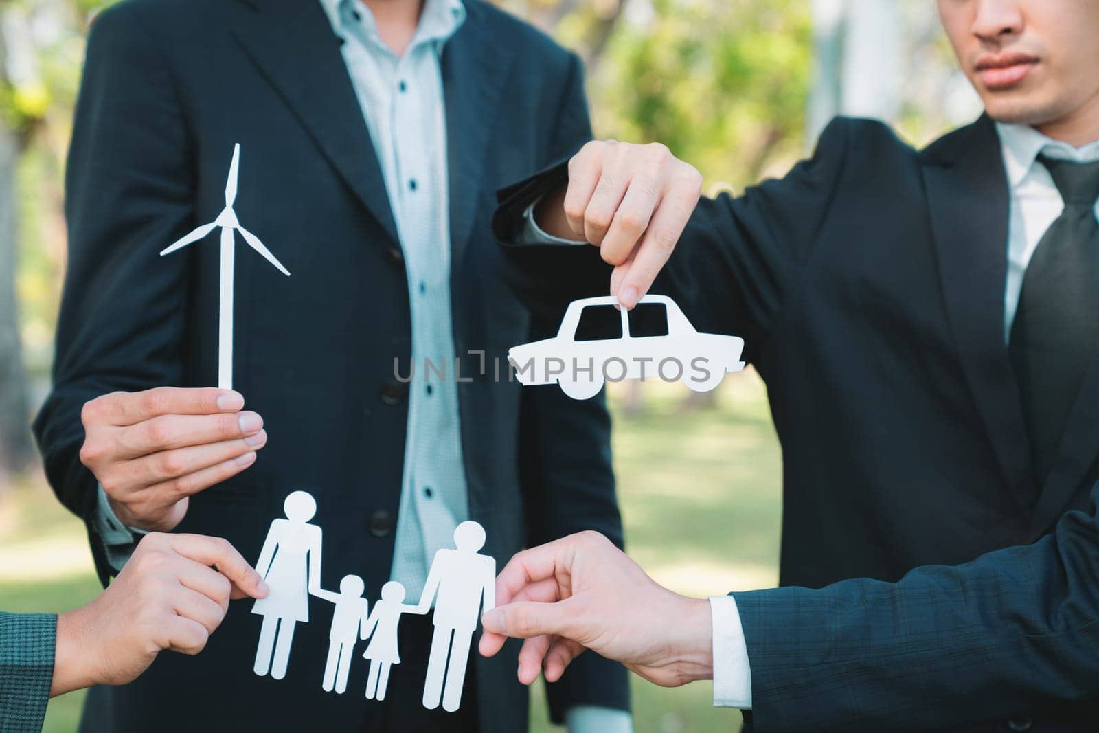 Business people holding ECO icon in nature. Gyre by biancoblue