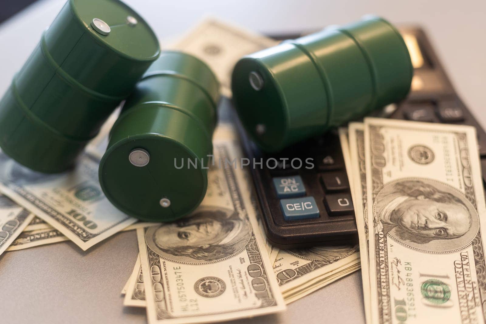 a barrel and dollar bills on a white background. High quality photo