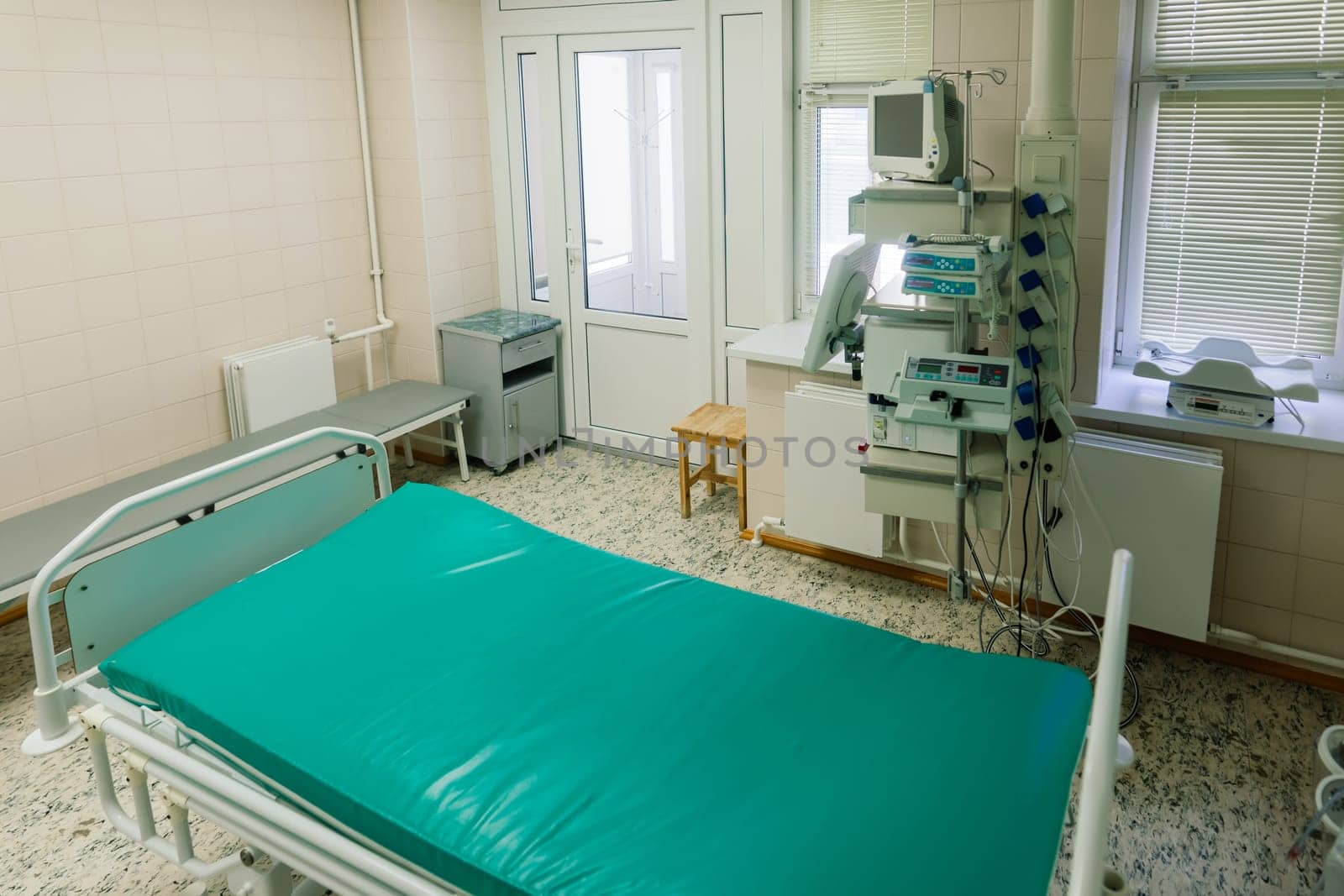 Interior of new operating room with equipment in modern clinic by Zelenin