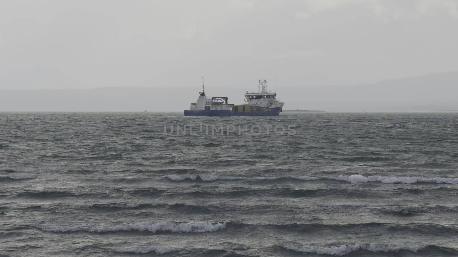 Gloomy Day at Sea: Fishing Vessel Facing Rough Waves by FerradalFCG