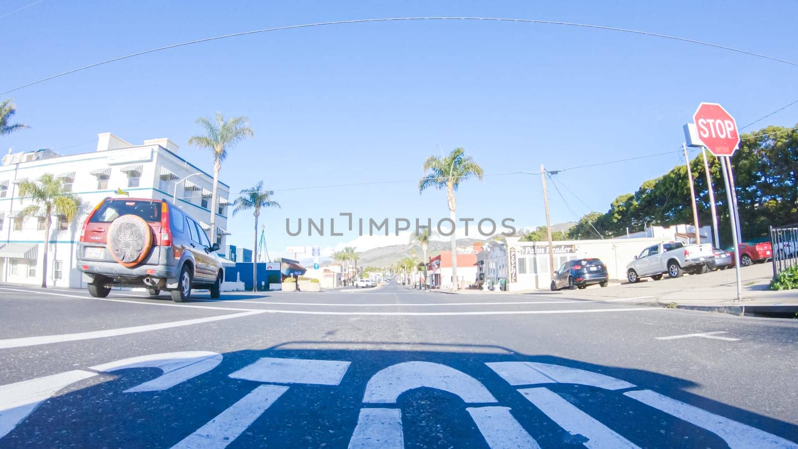 Santa Maria, California, USA-December 6, 2022-Car driving through the streets of Pismo Beach town, California during winter.