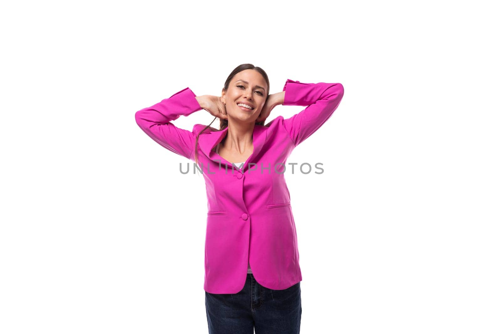 young pretty woman with black straight hair wears designer pink jacket sewn in atelier by TRMK