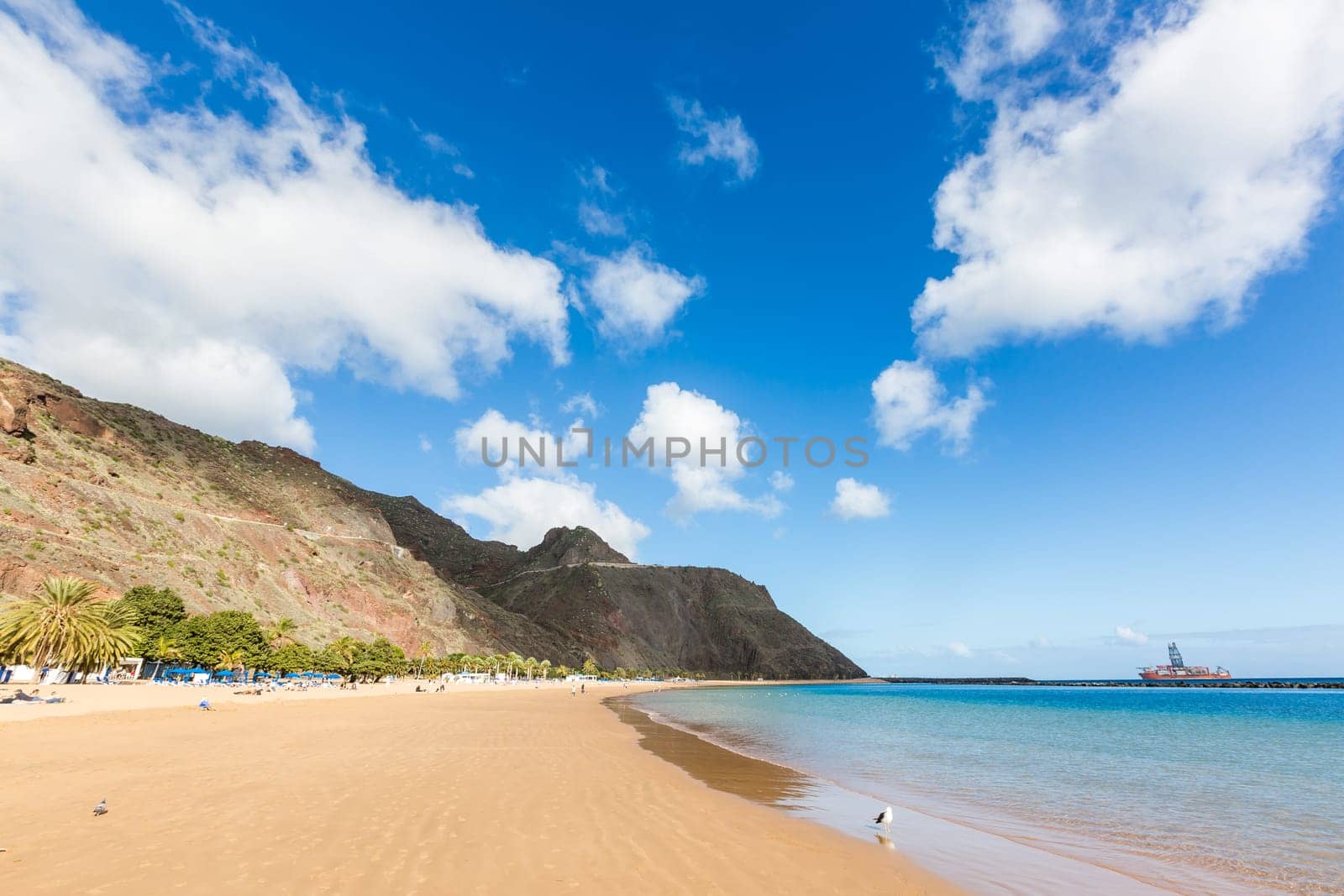 Perfect sandy beach in hot summer day.