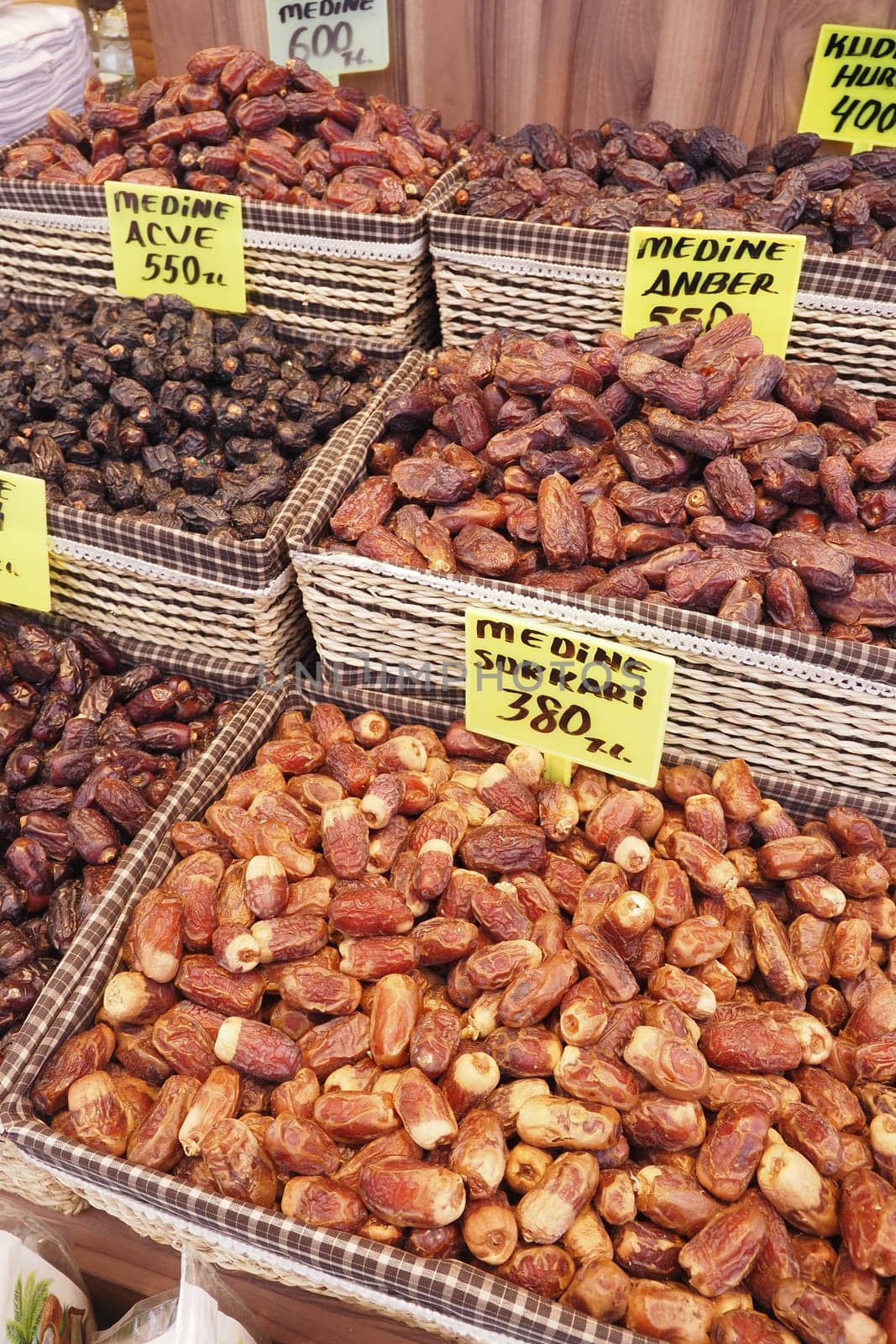 many date fruits display for sale at local market .