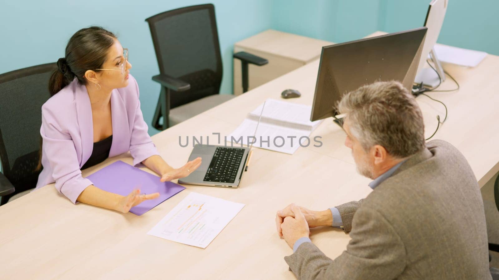 Woman telling a client that his request is not possible by ivanmoreno