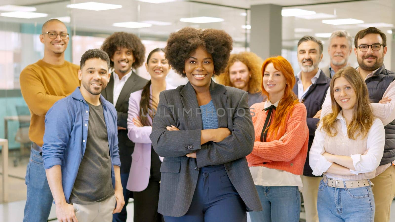 African female boss leading employees in a coworking by ivanmoreno