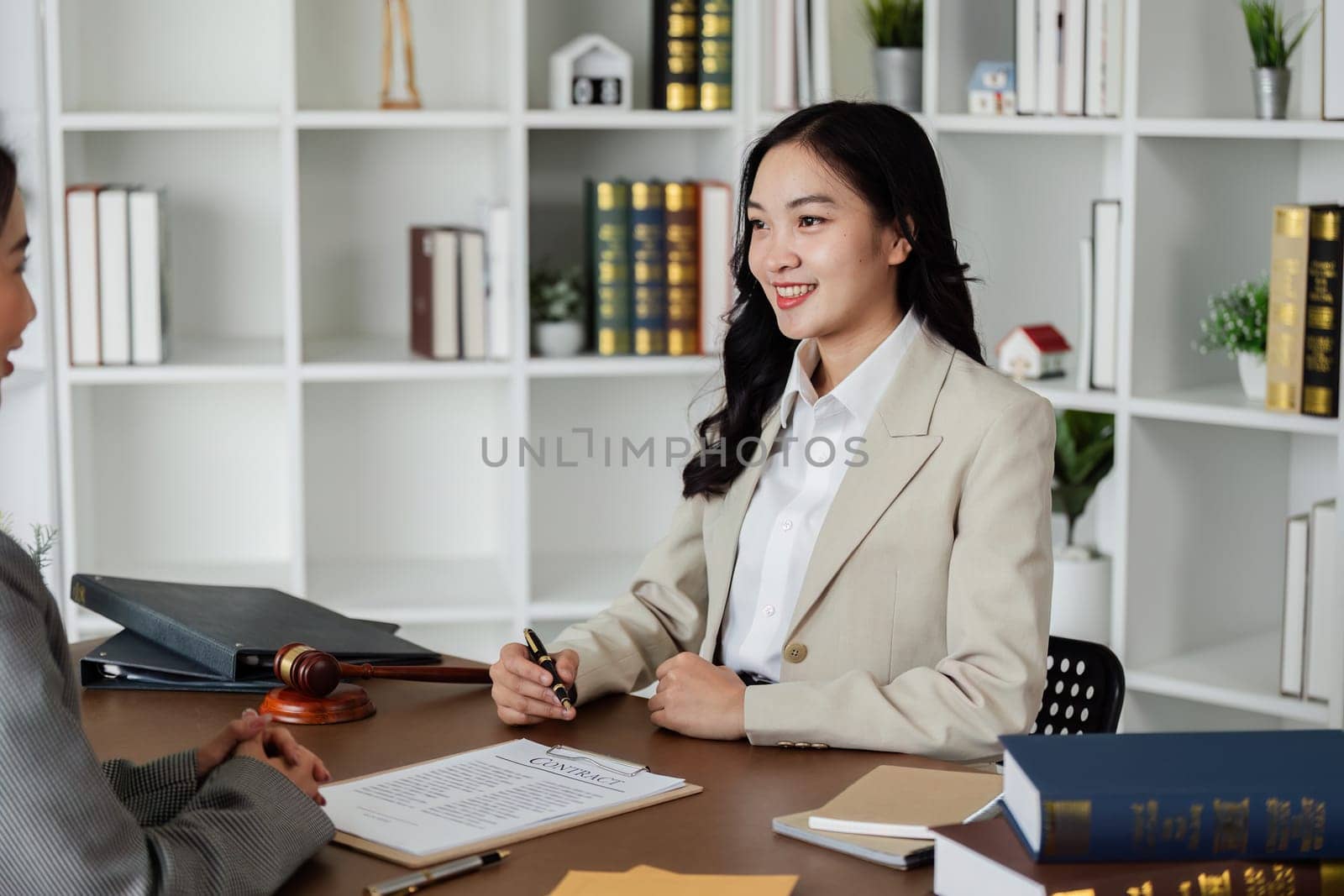 Lawyers provide advice to client are business partner. Lawyer working with client discussing contract document in office, consulting to help customer by itchaznong