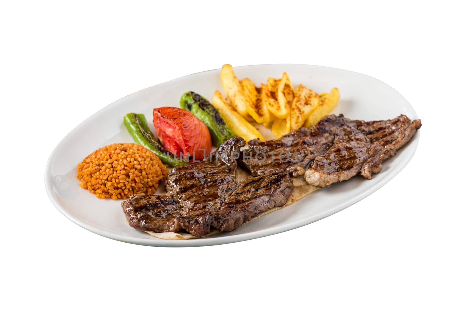 Grilled steak on white background. with bulgur pilaf, french fries, tomatoes garnish by Sonat