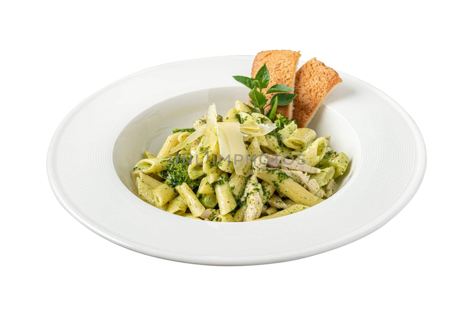 Penne pasta with pesto sauce, zucchini, green peas and basil.