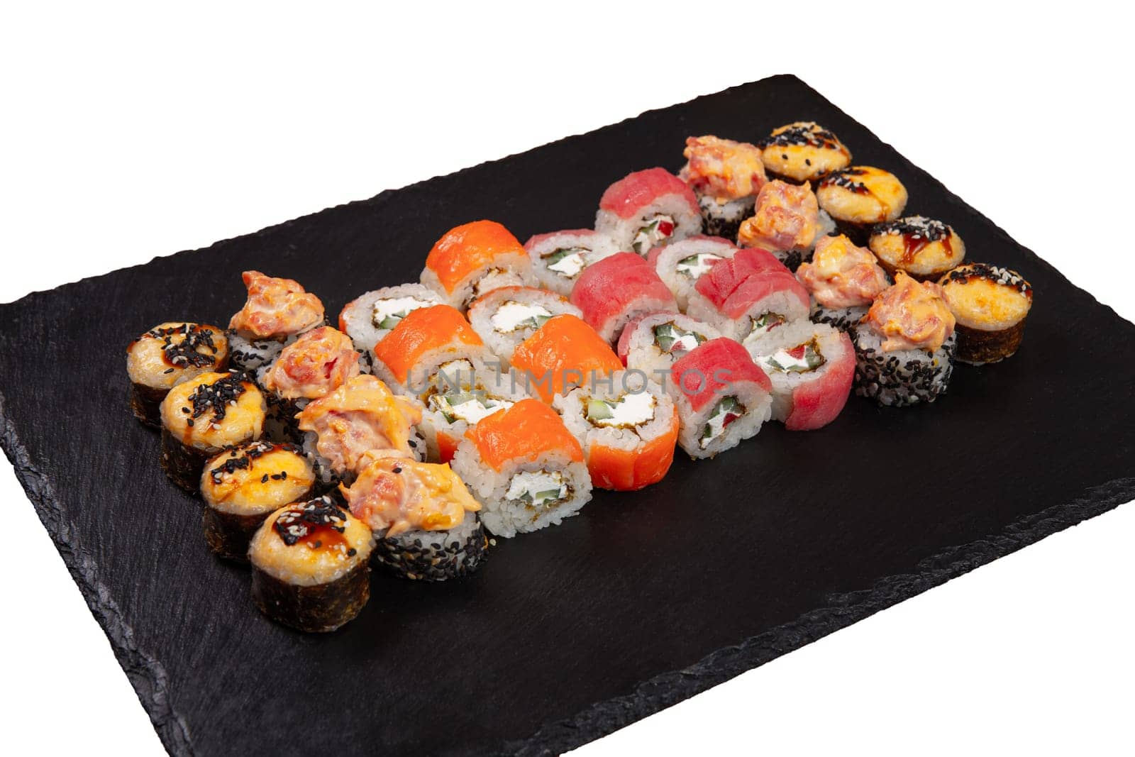 Sushi set served on black stone tray. by BY-_-BY