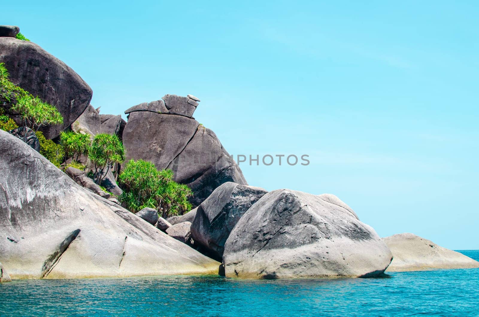 Rocks and stone beach Similan Islands with famous Sail Rock, Phang Nga Thailand nature landscape.