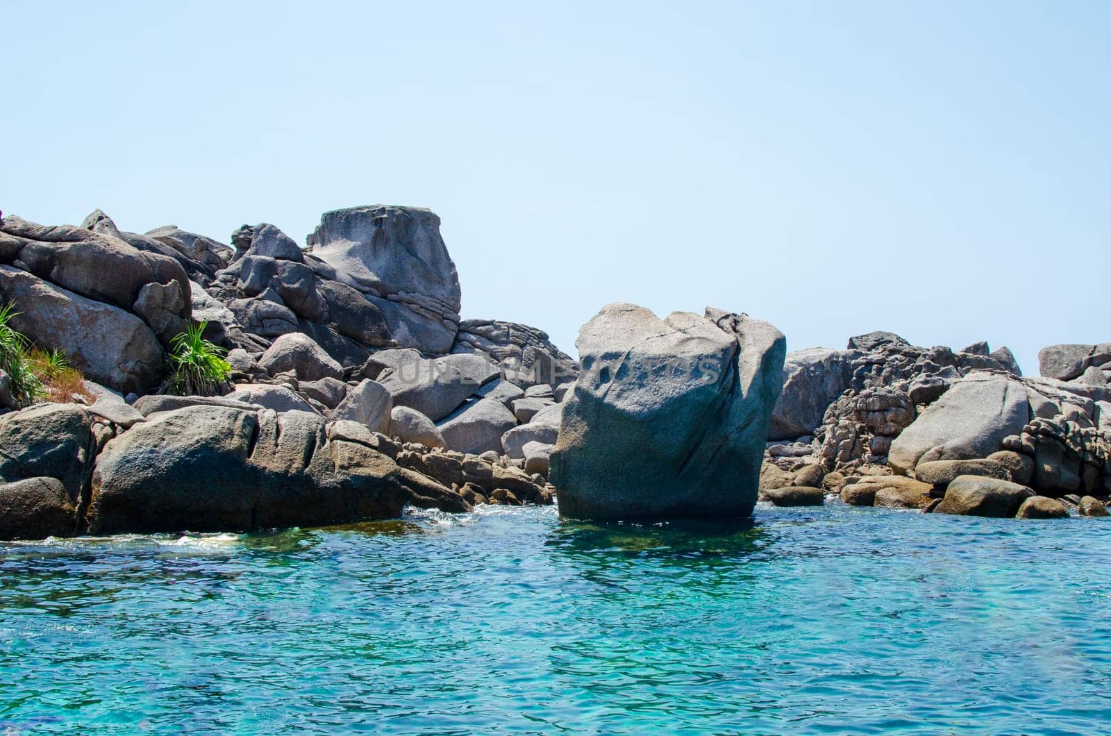 Rocks and stone beach Similan Islands with famous Sail Rock, Phang Nga Thailand nature landscape.