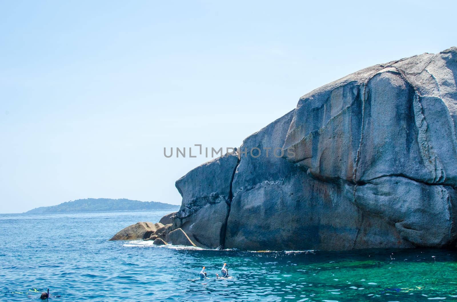 Rocks and stone beach Similan Islands with famous Sail Rock, Phang Nga Thailand nature landscape.