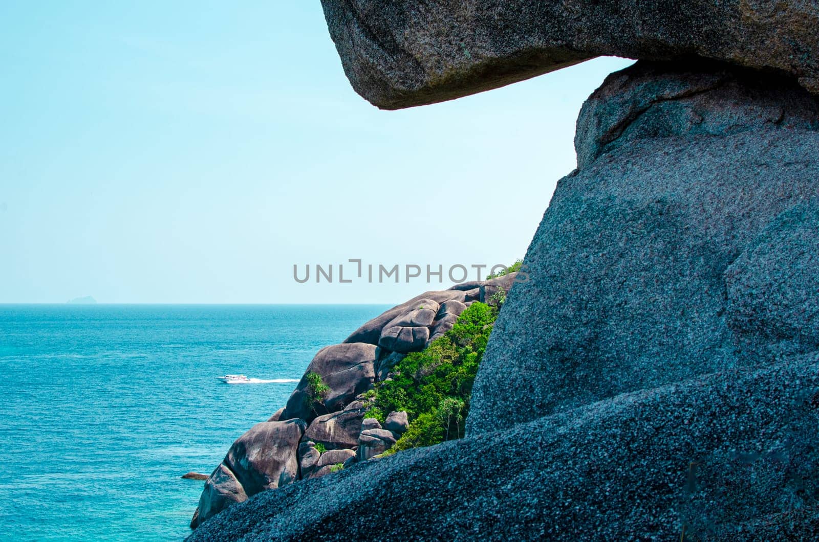 Tropical islands of ocean blue sea water and white sand beach at Similan Islands with famous Sail Rock, Phang Nga Thailand nature landscape by lucia_fox