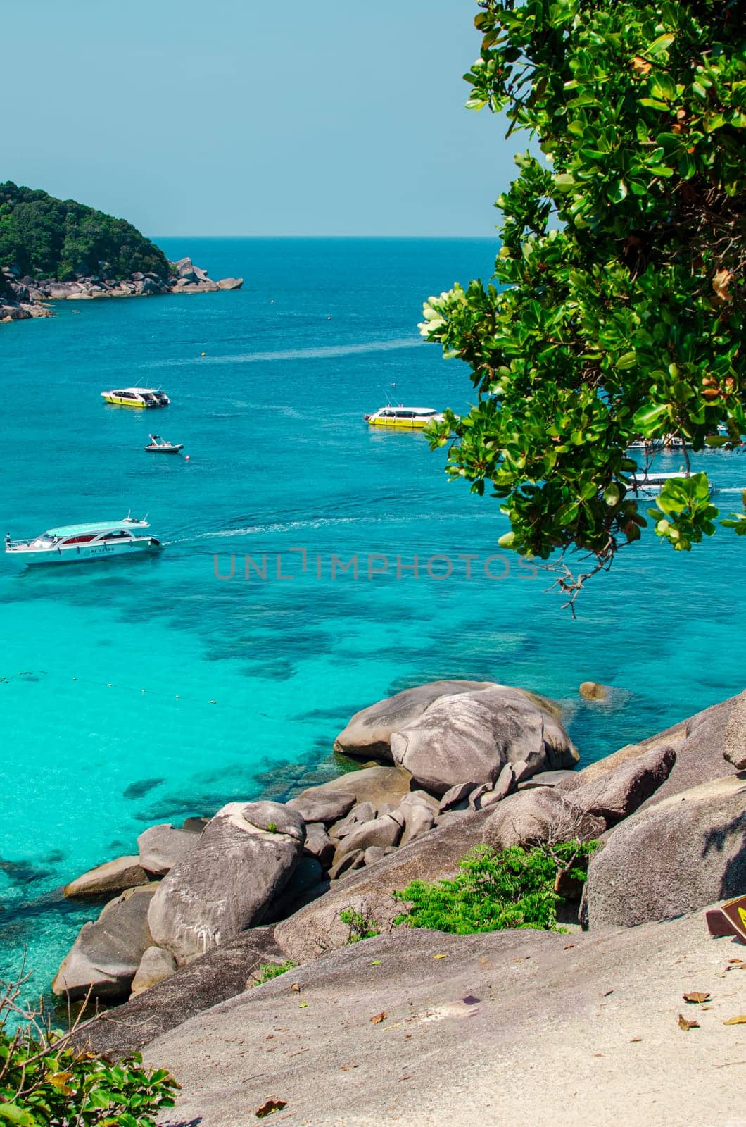 Tropical islands of ocean blue sea water and white sand beach at Similan Islands with famous Sail Rock, Phang Nga Thailand nature landscape. High quality photo