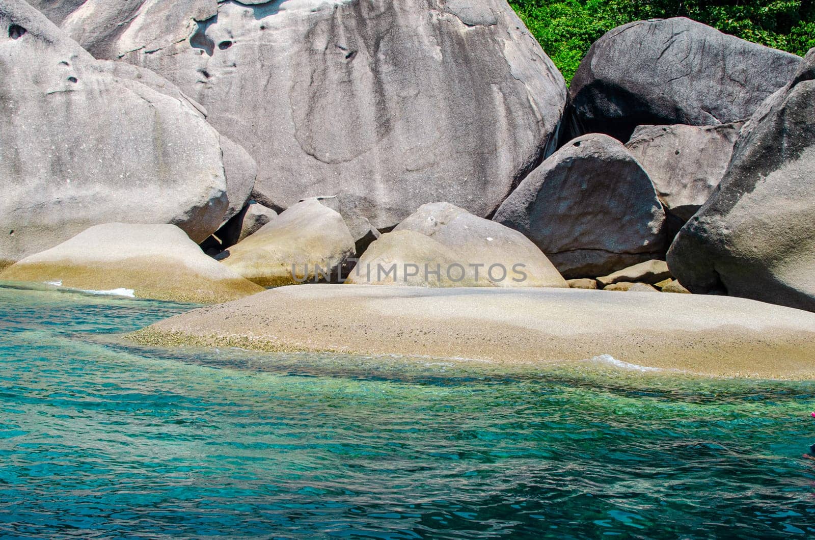 Rocks and stone beach Similan Islands with famous Sail Rock, Phang Nga Thailand nature landscape.