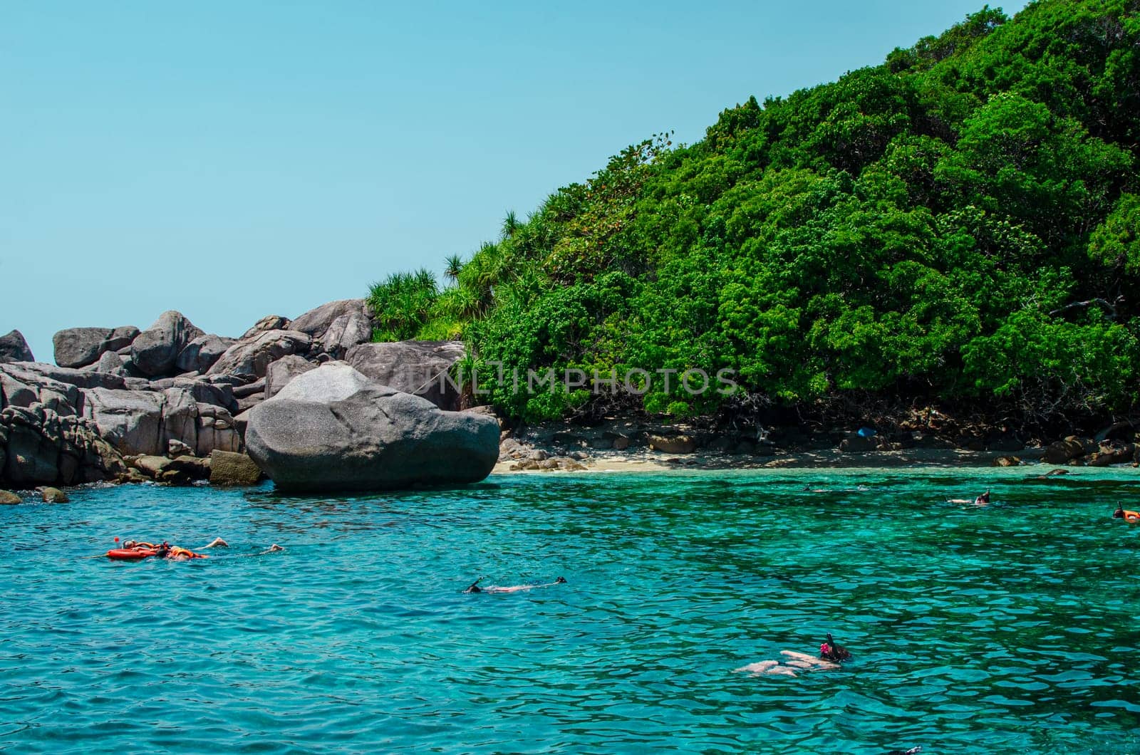 Tropical islands of ocean blue sea water and white sand beach at Similan Islands with famous Sail Rock, Phang Nga Thailand nature landscape by lucia_fox