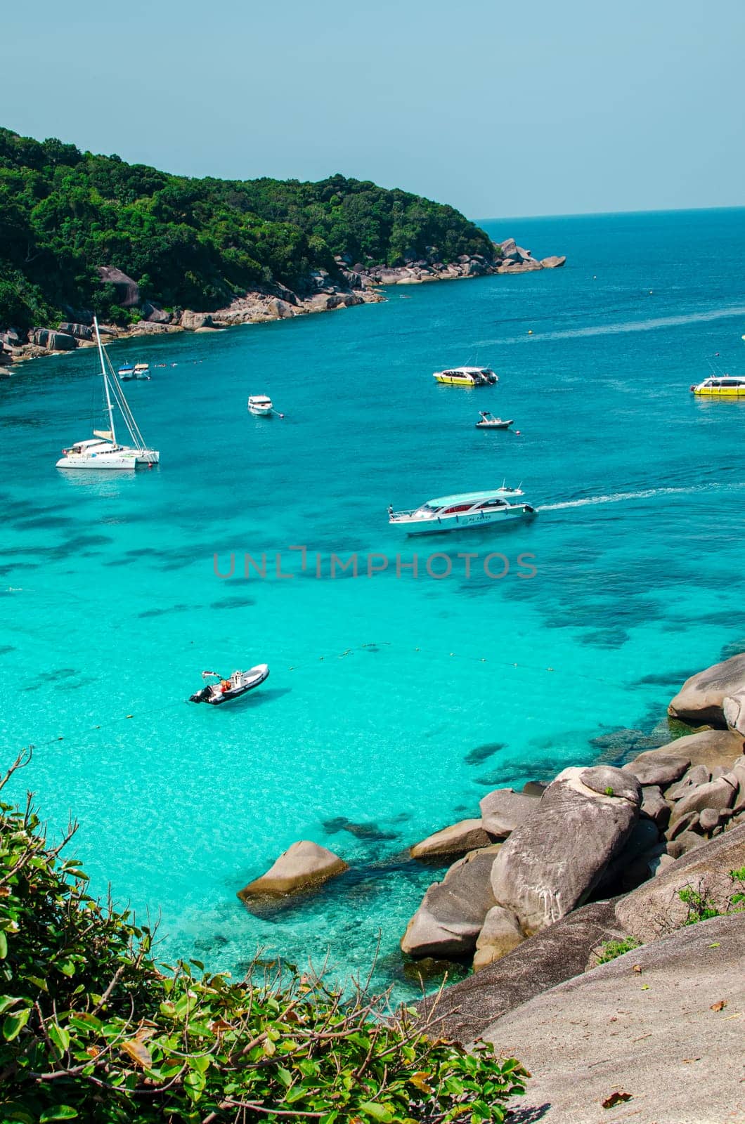 Tropical islands of ocean blue sea water and white sand beach at Similan Islands with famous Sail Rock, Phang Nga Thailand nature landscape by lucia_fox