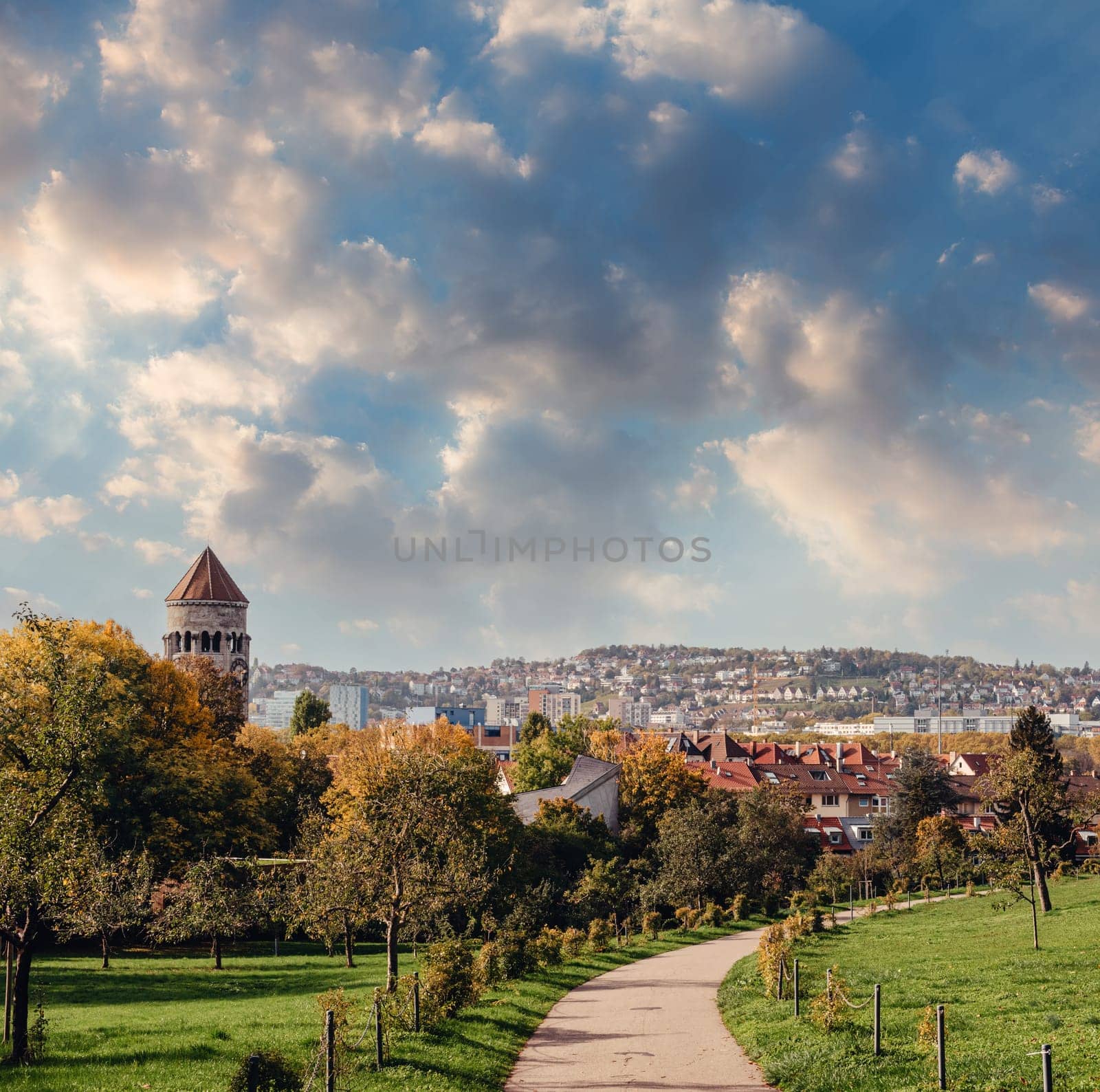 Germany, Stuttgart panorama view. Beautiful houses in autumn, Sky and nature landscape. Vineyards in Stuttgart - colorful wine growing region in the south of Germany with view over Neckar Valley. Germany, Stuttgart city panorama view above vineyards, industry, houses, streets, stadium and highway at sunset in warm orange light by Andrii_Ko