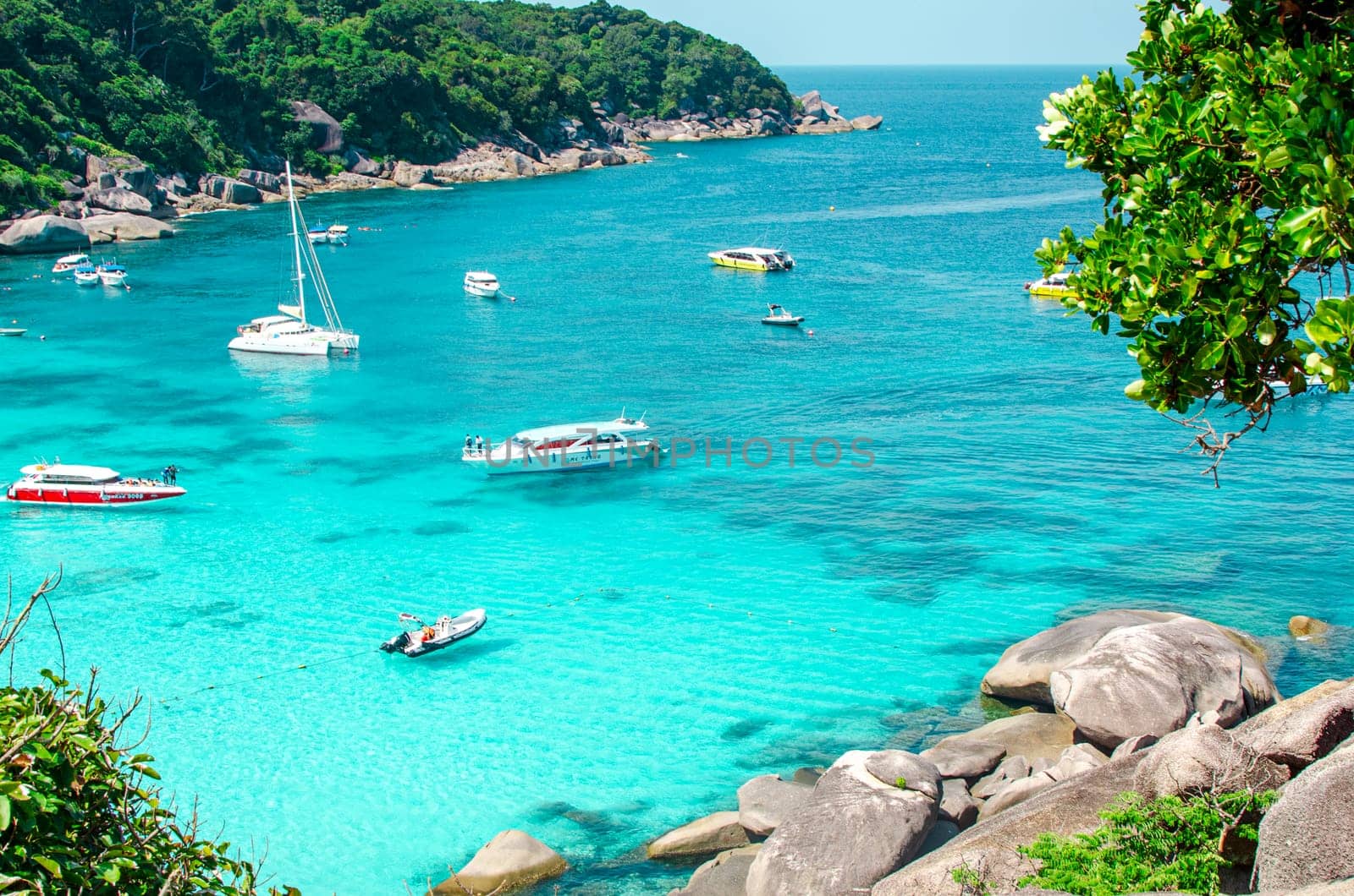 Tropical islands of ocean blue sea water and white sand beach at Similan Islands with famous Sail Rock, Phang Nga Thailand nature landscape. High quality photo