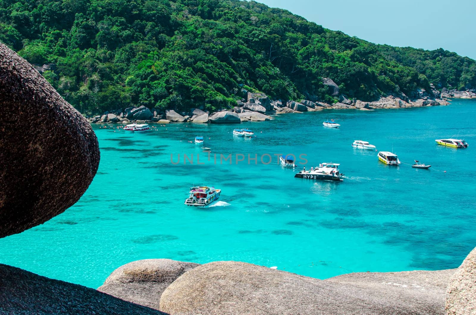 Tropical islands of ocean blue sea water and white sand beach at Similan Islands with famous Sail Rock, Phang Nga Thailand nature landscape. High quality photo