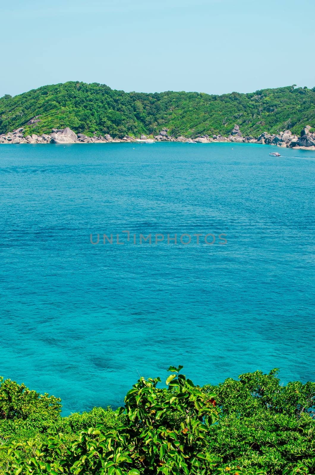 Tropical islands of ocean blue sea water and white sand beach at Similan Islands with famous Sail Rock, Phang Nga Thailand nature landscape by lucia_fox