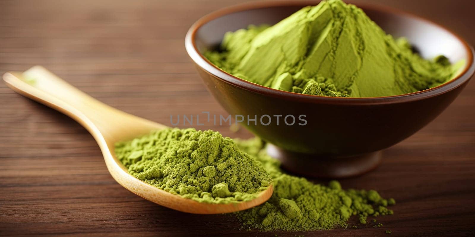MAtcha tea powder in a wooden spoon on a table
