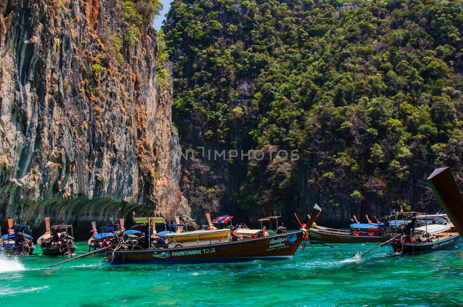 Views of the Islands of Thailand and turquoise water, rocks, yachts or boats.