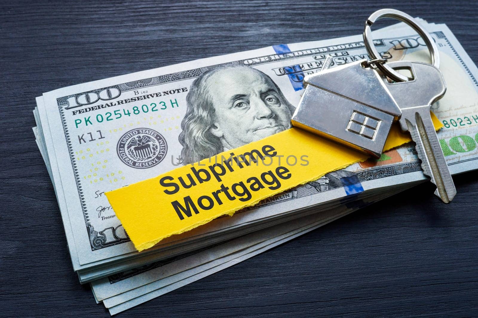 Subprime mortgage. Stack of cash and key. by designer491