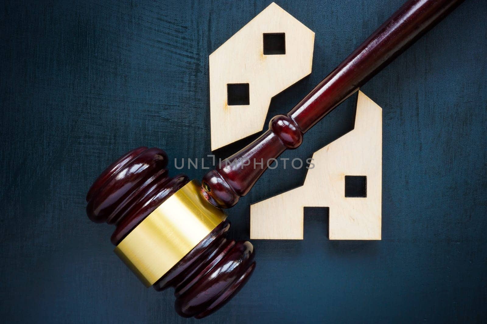 House of two parts and gavel. Division of real estate in case of divorce or inheritance.