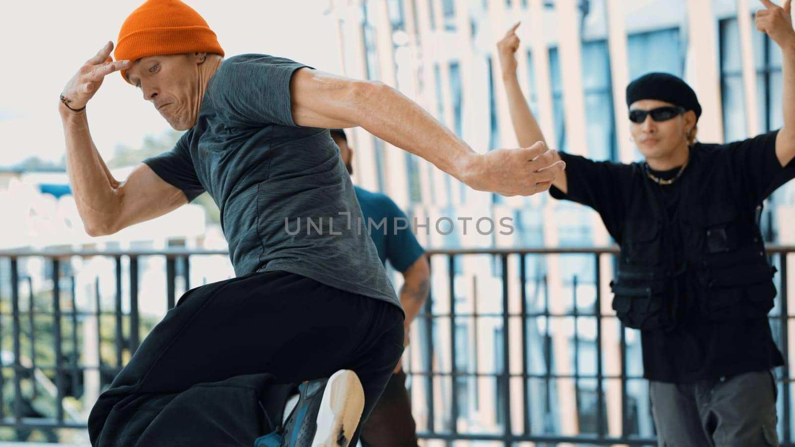 Skilled hipster perform break dancing while partner dancing together. Endeavor. by biancoblue