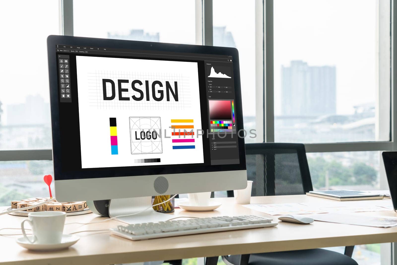 Graphic designer software for modern design of web page and commercial ads showing on the computer screen