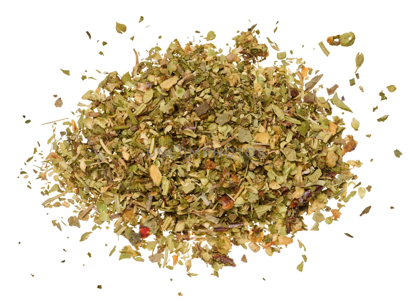 Chopped dry leaves of basil, parsley, dill and sun dried tomatoes on an isolated background. View from above
