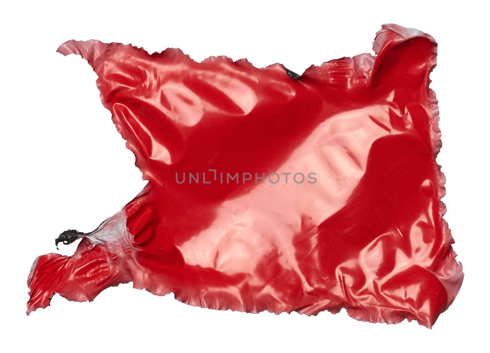 Torn piece of red polyethylene on isolated background, close up