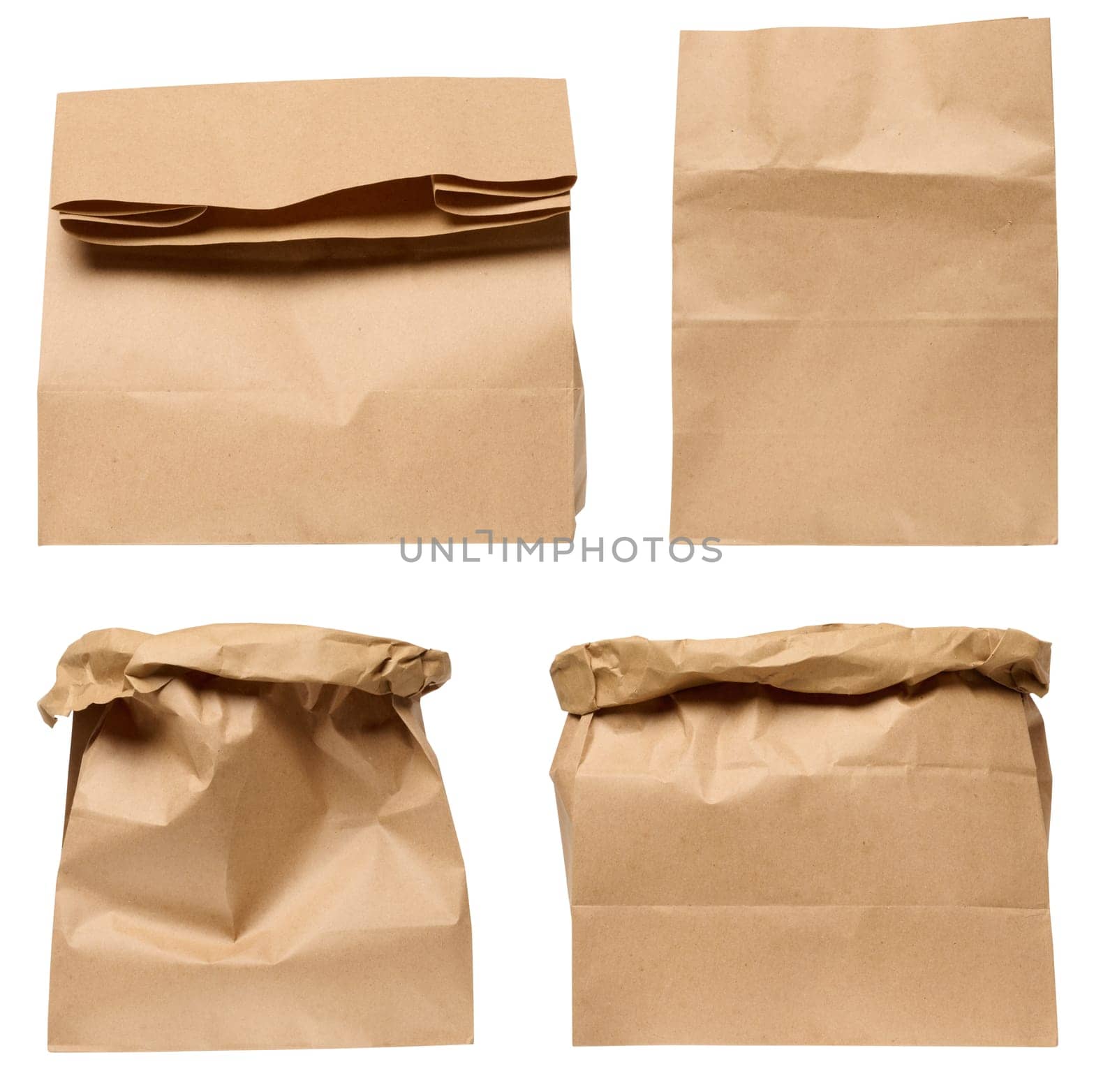 A large empty brown kraft paper bag for packaging products in stores on an isolated background, set