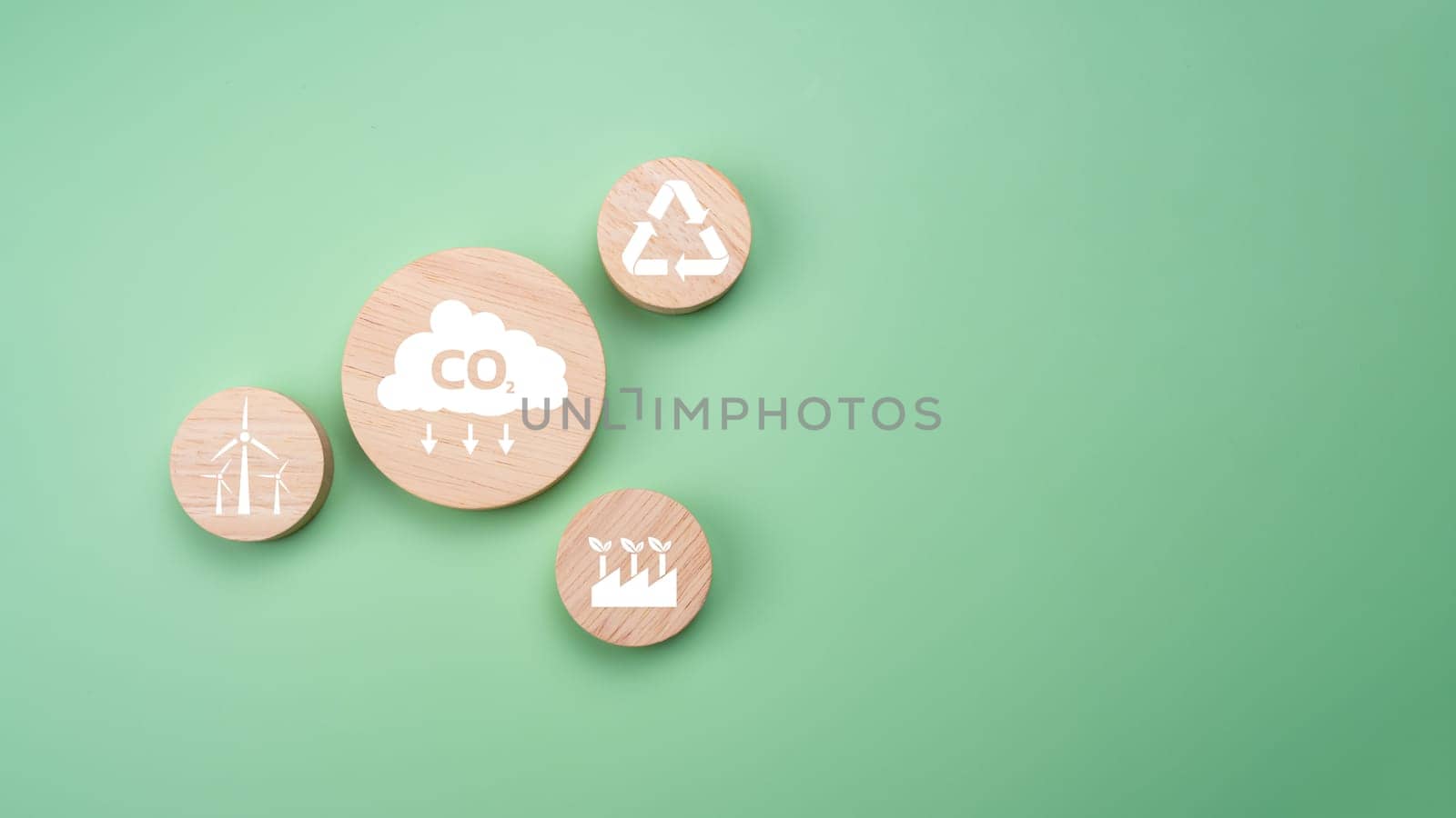 Circular wooden board with net zero icon in 2050 on green background, Net zero by 2050, Carbon neutral, Net zero green house gas emissions target, Climate neutral long term strategy, No toxic gases.  by Unimages2527