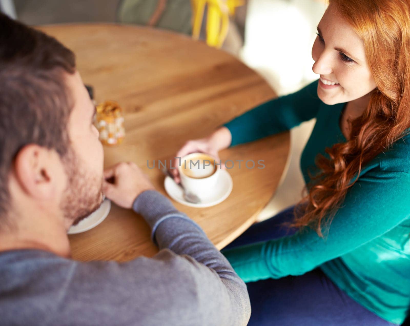 Restaurant, date and couple with coffee, conversation and marriage with romance and trust. Cafe, man or woman with morning or bonding together with care or relationship with love, cappuccino or flirt by YuriArcurs